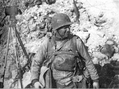 Rudder at Pointe du Hoc, mid-afternoon, June 7, 1944. "Don't lose this," he wrote to his wife. "It was taken by Maj. Jack Street and holds much history for me. I have enough equipment to weigh down a horse." Photo courtesy of Margaret Rudder, reprinted courtesy of Texas A&M University Press. Rudder at Pointe du Hoc