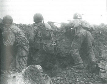Men of the 2nd Ranger Battalion in the defensive perimeter of Rudder's command post on Point du Hoc. Photo courtesy of the U.S. National Archives. The Second Ranger Battalion