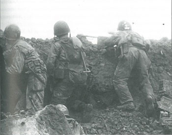 Men of the 2nd Ranger Battalion in the defensive perimeter of Rudder's command post on Point du Hoc. Photo courtesy of the U.S. National Archives. The Second Ranger Battalion