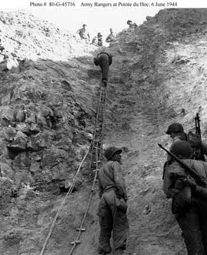 U.S. Army Rangers show off the ladders they used to storm the cliffs at Pointe du Hoc, June 6, 1944. Official U.S. Navy photograph, collection in the National Archives. Ladders Used to Storm Cliffs