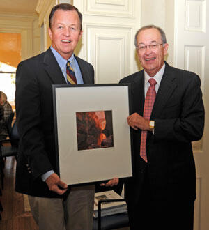 Joe Krier and Julius Glickman. Glickman is presenting Krier with a Bill Wright photograph to thank him for his service to the board.