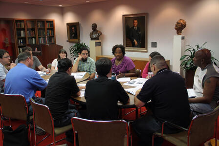 Tiffany Gill, associate professor of history at The University of Texas at Austin, leads a primary source workshop at the Lyndon Baines Johnson Library and Museum. Tiffany Gill leads a workshop