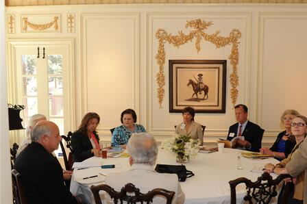 Former board members meet with the site visit team in the dining room. In the background is a painting by Texas artist Tom Lea, on loan from the collection of Ann and Bill Kiely. Clockwise from left: Manuel Medrano, Edie Manza, Norma Cantú, Fran Vick, Ellen C. Temple, Joseph R. Krier, JoAnn Christian, Lynn Denton, and Nick Kanellos (back to camera). Former board members
