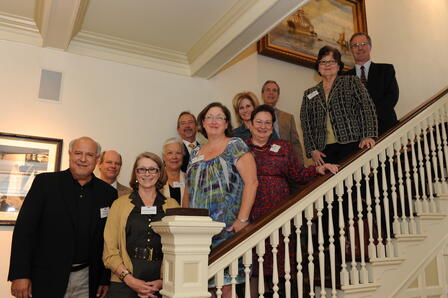 Members of the site team with cultural partners. Clockwise from top of stairs: David Denney, director of public programming at the Bob Bullock Texas State History Museum; Peggy Rudd, director and librarian of the Texas State Library and Archives Commission; Pat Smith, executive director of the Texas Library Association; Ruth Ann Rugg, executive director of the Texas Association of Museums; Lynn Denton; Manuel Medrano; Stan Graves, director of the Architecture Division of the Texas Historical Commission; Edie Manza; J. Kent Calder, executive director of the Texas State Historical Association; Kerry Ballast, director of special projects in standards and programs at the Texas Education Agency; and Michael L. Gillette, HTX executive director. Site Team members and cultural partners