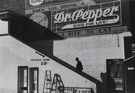 Negro going in colored entrance of movie house on Saturday afternoon, Belzoni, Mississippi Delta, Mississippi. Photo by Marion Post Wolcott. Library of Congress Prints and Photographs Division. The colored entrance to a movie house, Belzoni, Mississippi