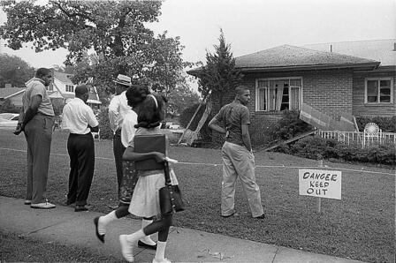 Group of African Americans viewing the bomb-damaged home of Arthur Shores, NAACP attorney, Birmingham, Alabama. Photo by Marion S. Trikosko. Library of Congress Prints and Photographs Division. The bombed home of an NAACP attorney in Birmingham, Alabama