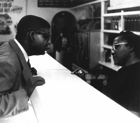 Griffin orders a meal from one of the many Negro cafes he frequented. Photo by Don Rutledge, reprinted with the permission of Wings Press. Griffin ordering a meal